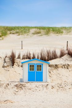 Colorfull Dutch house on the beach with blue sky. Texel, Holland