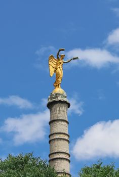 The Victory statue on the column in the palmier fountain in Paris. France