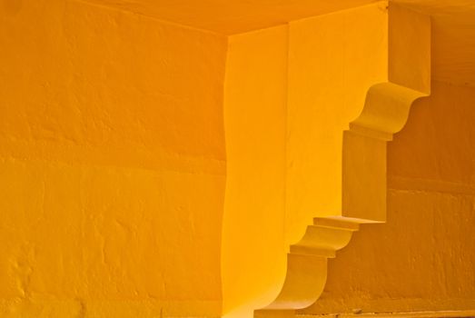 Yellow adobe walls with arcitectural details Mexico