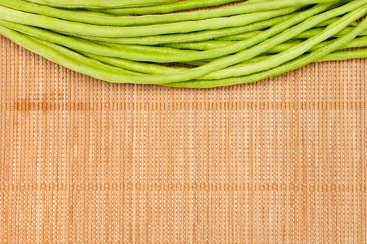 abstract design background vegetables on a bamboo mat background