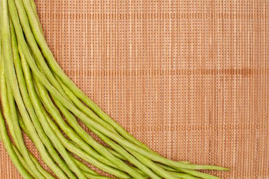 abstract design background vegetables on a bamboo mat background