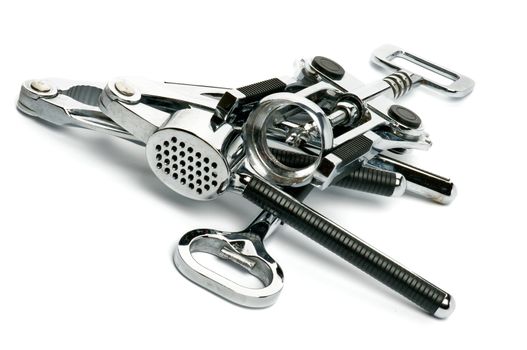 Heap of Kitchen Tools with Corkscrew, Garlic Press, Nutcracker and Openerisolated on white background