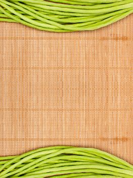 abstract design background vegetables on a wooden bamboo matbackground