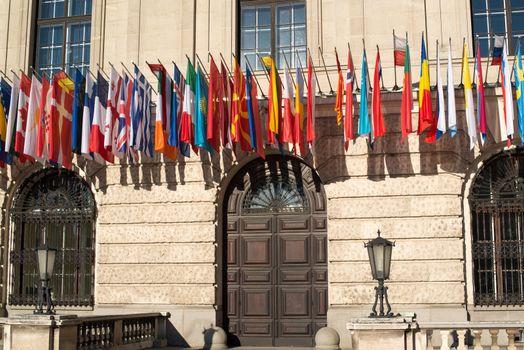 Set of international flags in front of Hofburg palace in Vienna, Austria