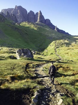 Young man hiking in the mountains