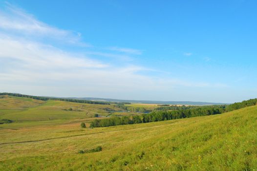 Summer landscape. Blue sky with clouds.