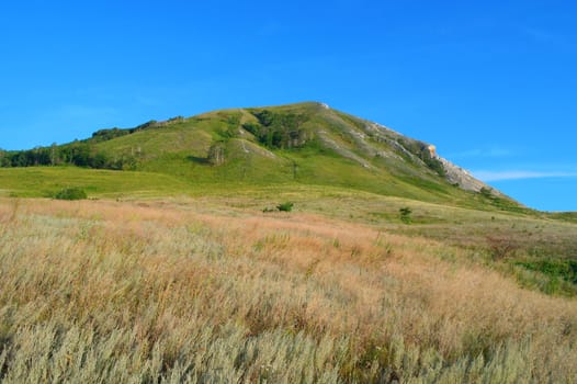 Summer landscape with mountain and blue sky