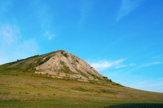 Summer landscape with high mountain and blue sky