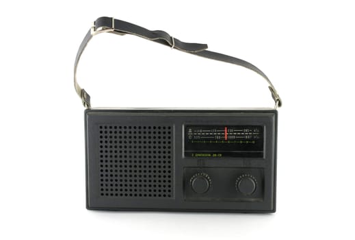 Black pocket radio over white