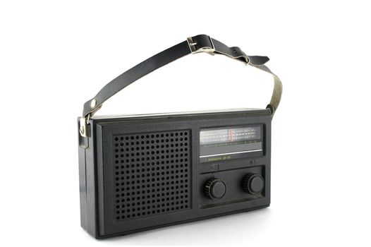 Old pocket radio over white