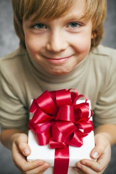 Smiling Boy holding present box