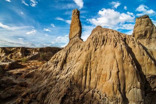 A stone pillar in a desolate wasteland.