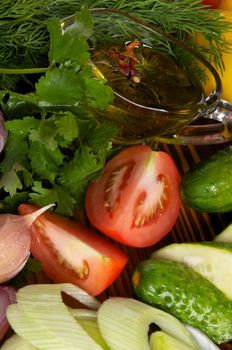 Arrangement of Vegetable Salad Ingredients with Tomatoes, Cucumber, Garlic, Parsley, Leek and Olive Oil close up