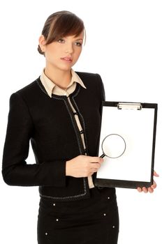 New worker making presentation with the white blank paper and a magnifier