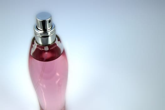 Pink perfume bottle on blue background