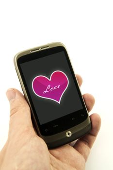 Hand holding phone with valentine heart. Pink heart with love message
