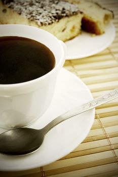 Coffee and cheesecake on bamboo mat