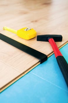 Floor panes tools. Hammer, measure