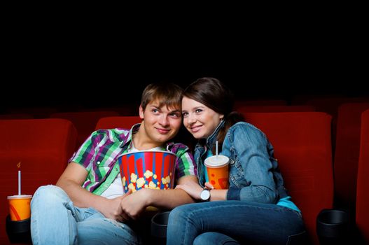 couple in a movie theater, watching a movie