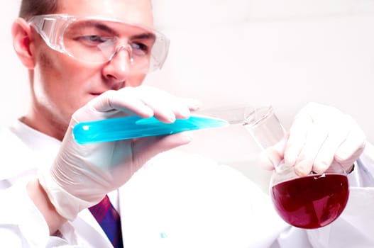 chemist working in the laboratory, mix liquid