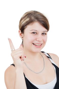 young brunette smiling woman is pointing her forefinger up 