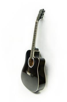 Black electro-acoustic guitar on white