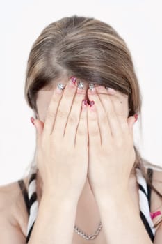 Sad woman with hands on face isolated on white background 