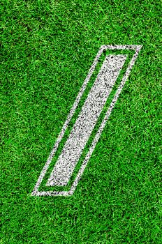 White line number on green grass