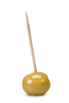 Green olive on a toothpick isolated on a white background