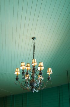 vintage chandelier in pastel blue color vintage wood wall room