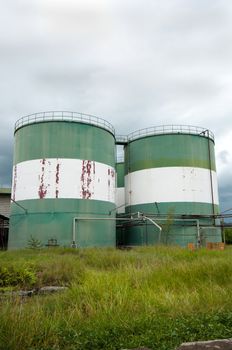 picture of  abandon storage tanks on cloudy background