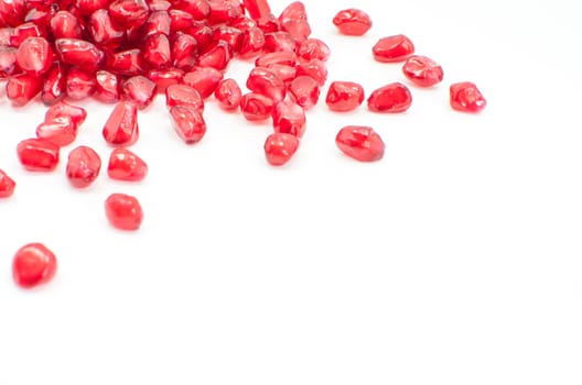  pomegranate seeds isolated on white selective focus