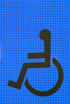 sign disabled icon on blue grating metal