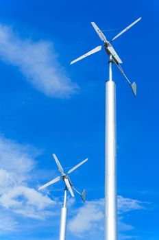 wind turbine on cloudy blue sky