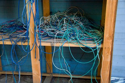 Electric cables and cords are messy in a storage unit.