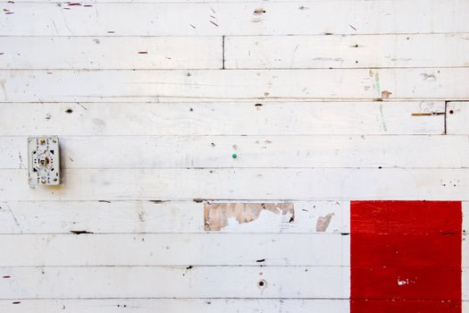 A white wall with red paint for design layouts and copy space.