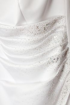 Sequins and ripples define the back detail of this beautiful wedding dress.