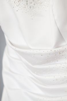 Back detail of a gorgeous white wedding dress.