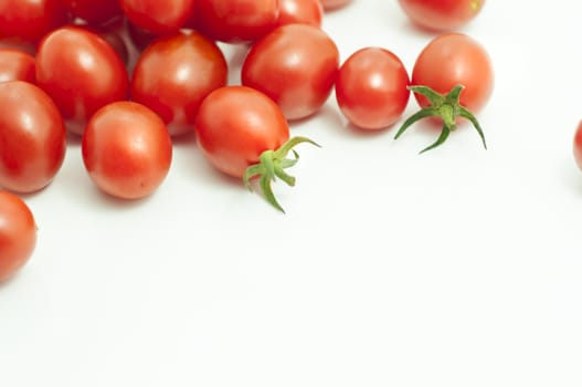 photo of very fresh tomatoes presented on white background