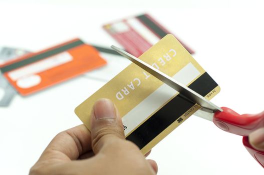 cutting up credit card with scissors