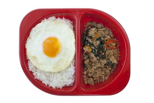 Chicken sauteed with garlic and hot basil set on steamed rice with fried egg