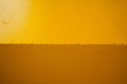 Abstract shot of the edge of a building turned horizontally to create a background image of two shades of color.