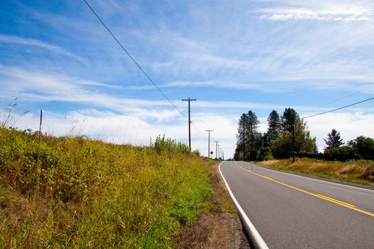 A rural highway extends into the distance.