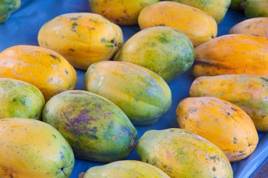 Organic papayas are sold fresh at a small farmer's market along the north shore of oahu hawaii.