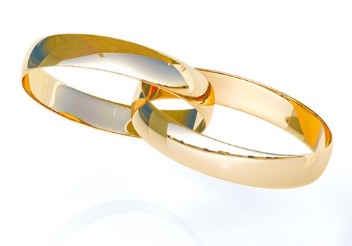 Wedding rings on a light background with reflections
