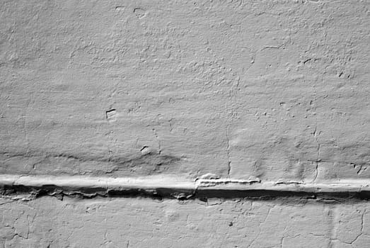 Stone wall in grunge style with many cracks