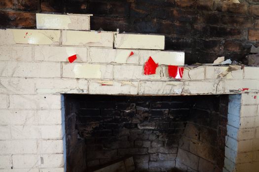 Ruins of an old fire place in an abandoned home after a fire.