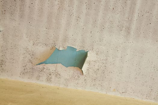 Details of a wall in very bad shape including discoloration and markings, great textured background images with copy space.