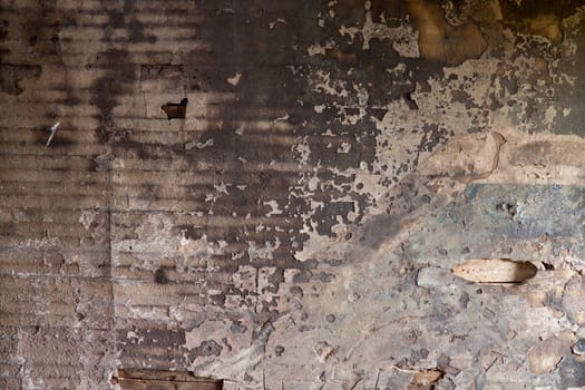 Details of a wall in very bad shape including discoloration and markings, great textured background images with copy space.