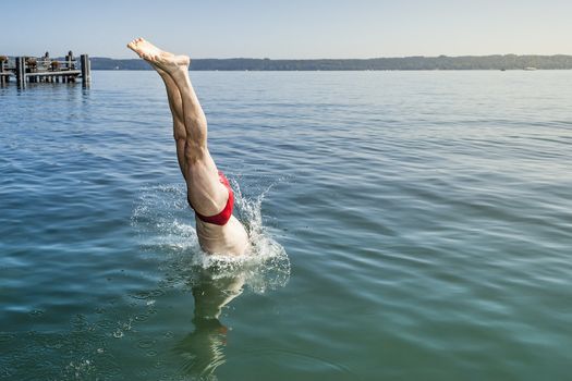 An image of a man jumping into the water